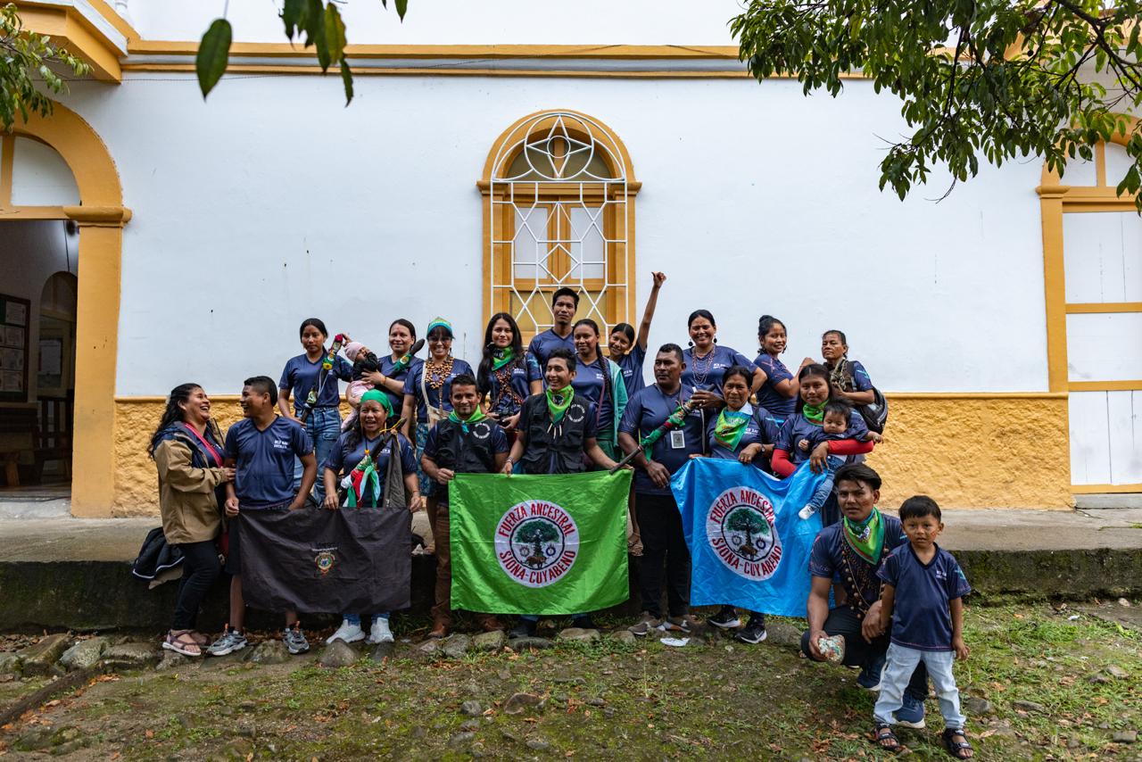 Members of the community gathered with their flags